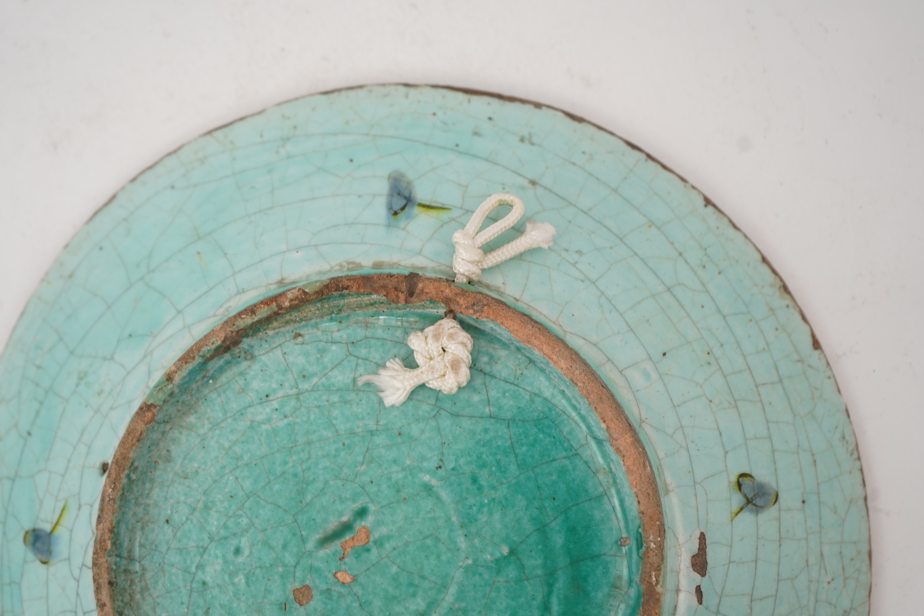 An Iznik pottery turquoise glazed dish, Ottoman Turkey, c.1650-1700